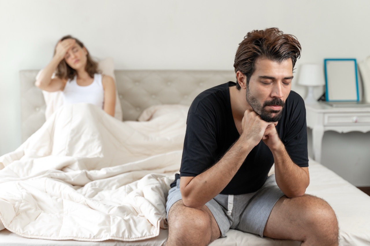 selective-husband-sitting-bed-with-feel-bored-about-her-wife Large